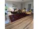 Bright living room featuring hardwood floors, a modern sofa, chairs, and stylish decor at 222 Braly Dr, Summerville, SC 29485