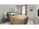 Inviting bedroom featuring neutral decor, large window, and relaxing ambiance at 223 West Bradford Pointe Dr, Summerville, SC 29486
