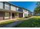 Exterior view of multi-Gathering home featuring brick accents, a covered porch, and manicured landscaping at 2494 Etiwan Ave # B-4, Charleston, SC 29414