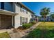 Exterior elevation of a well-maintained residential building with landscaped walkway at 2494 Etiwan Ave # B-4, Charleston, SC 29414