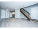 View of living room featuring stairs, light grey walls, and modern flooring at 2494 Etiwan Ave # B-4, Charleston, SC 29414