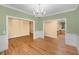 Dining room featuring hardwood floors, wainscoting and an open doorway that leads into the kitchen at 2734 Old Forest Drive, Seabrook Island, SC 29455