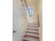 Elegant staircase with wood treads, white risers, and a bright window at the landing at 2734 Old Forest Drive, Seabrook Island, SC 29455