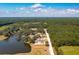 Aerial view of home located on wooded lot with pond at 2982 Lodge Berry Ln, Johns Island, SC 29455