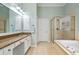 Bathroom with double vanity, bathtub, and glass door shower at 3004 Riverwood Dr, Mount Pleasant, SC 29466