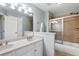 Spacious bathroom with a double vanity, large mirror, and tiled shower at 3004 Riverwood Dr, Mount Pleasant, SC 29466
