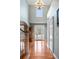 Bright foyer features soaring ceilings, hardwood floors, and a beautiful chandelier that provides ample illumination at 3004 Riverwood Dr, Mount Pleasant, SC 29466