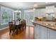 Bright kitchen featuring white cabinetry, stainless steel appliances, granite countertops, and a breakfast nook at 3004 Riverwood Dr, Mount Pleasant, SC 29466