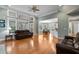 Spacious living room features hardwood floors, neutral walls, and abundant natural light from the large windows at 3004 Riverwood Dr, Mount Pleasant, SC 29466