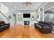 Cozy living room with a fireplace, built-in shelving, hardwood floors, and comfortable seating for relaxing at 3004 Riverwood Dr, Mount Pleasant, SC 29466