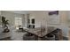 Modern living room seamlessly flows to dining area, and features large windows at 304 Pine Crest View Dr, Summerville, SC 29486