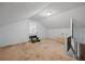 Attic shows staircase, carpet, white walls, and natural lighting at 305 Meadowlark Ln, Moncks Corner, SC 29461