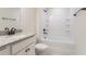 Bright bathroom with a white vanity, granite counters, and shower with tile surround at 306 O'Malley Dr, Summerville, SC 29483