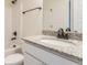 Bathroom vanity includes stone countertop, bronze faucet, undermount sink, and tiled walls at 306 O'Malley Dr, Summerville, SC 29483