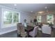 Open-concept dining area bathed in natural light, with views of the outdoors at 306 O'Malley Dr, Summerville, SC 29483