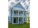 Charming two-story home with light blue siding, white trim and a cozy second story balcony at 306 O'Malley Dr, Summerville, SC 29483