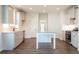 Bright kitchen includes granite countertops, center island, stainless appliances, and wood-look floors at 306 O'Malley Dr, Summerville, SC 29483