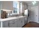 Well-lit kitchen with white cabinets, stainless steel appliances, subway tile backsplash, and modern sink at 306 O'Malley Dr, Summerville, SC 29483