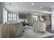 Cozy living room with fireplace, dark wood floors, recessed lighting and neutral colored modern furniture at 306 O'Malley Dr, Summerville, SC 29483