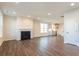 Open-concept living room featuring a fireplace and seamless access to the kitchen at 306 O'Malley Dr, Summerville, SC 29483