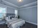 Serene main bedroom featuring a tray ceiling, and two windows for natural light at 306 O'Malley Dr, Summerville, SC 29483