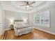 Spacious main bedroom with a tray ceiling, a ceiling fan and wood floors at 3066 Penny Ln, Johns Island, SC 29455