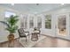 Bright sunroom with lots of windows, hardwood floors, and a decorative ceiling at 3066 Penny Ln, Johns Island, SC 29455