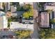 Overhead aerial view revealing a mix of residential buildings, mature trees, and street parking at 32 Tradd St, Charleston, SC 29401