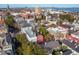 Expansive aerial view showcasing historic homes, lush greenery, and the iconic Arthur Ravenel Jr. Bridge at 32 Tradd St, Charleston, SC 29401