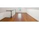 Bright attic space with hardwood floors, white walls, staircase, and natural light at 32 Tradd St, Charleston, SC 29401