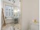 Bright bathroom with a modern glass shower, natural light, and stylish fixtures at 32 Tradd St, Charleston, SC 29401