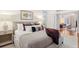 Serene bedroom connected to a living space, features a plush bed and stylish accents at 32 Tradd St, Charleston, SC 29401