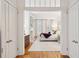 Inviting bedroom boasts hardwood floors, plantation shutters, and a decorative fireplace at 32 Tradd St, Charleston, SC 29401