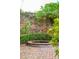 Brick-paved courtyard featuring lush greenery and serene water feature with brick border at 32 Tradd St, Charleston, SC 29401
