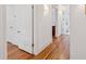 Bright hallway features gleaming hardwood floors and white doors leading to various rooms at 32 Tradd St, Charleston, SC 29401