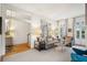 Sunlit living room with neutral color palette and stylish furnishings at 32 Tradd St, Charleston, SC 29401