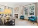 Bright living room with fireplace, neutral carpet, and well-lit sitting areas at 32 Tradd St, Charleston, SC 29401