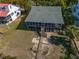 Aerial view of the beach house with screen porch and beach access path at 3408 Palmetto Blvd, Edisto Island, SC 29438