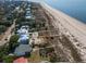 Coastal homes nestled among trees and dunes, offering serene beach access at 3408 Palmetto Blvd, Edisto Island, SC 29438