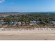 Beachfront houses with mature trees and dune landscaping, aerial view at 3408 Palmetto Blvd, Edisto Island, SC 29438