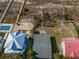 Aerial view of beach house with pool, boardwalk, and dune landscaping at 3408 Palmetto Blvd, Edisto Island, SC 29438