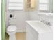 Bright bathroom with a toilet, sink, and a window with natural lighting at 3408 Palmetto Blvd, Edisto Island, SC 29438