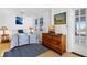 Cozy bedroom with wood dresser, lamps, ceiling fan, and natural light at 3408 Palmetto Blvd, Edisto Island, SC 29438