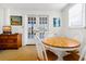 Charming breakfast nook with wood table, chairs, and bright lighting at 3408 Palmetto Blvd, Edisto Island, SC 29438