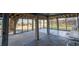 Open ground-level concrete patio with staircase and lattice privacy fence at 3408 Palmetto Blvd, Edisto Island, SC 29438