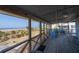 Spacious screened porch with ocean view, dining set, and rocking chairs at 3408 Palmetto Blvd, Edisto Island, SC 29438