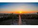 Breathtaking sunset view over the ocean from the backyard, with a wooden walkway leading to the beach at 3408 Palmetto Blvd, Edisto Island, SC 29438