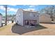 Backyard view of home featuring solar panels, small patio, and ample yard space at 3426 Kirkwall Dr, Summerville, SC 29485