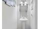 Powder room with pedestal sink and decorative wall art at 3426 Kirkwall Dr, Summerville, SC 29485