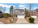 Charming two-story home with gray siding, a two-car garage, and a well-maintained front yard at 3426 Kirkwall Dr, Summerville, SC 29485